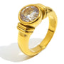 isolated gold plated stainless steel ring with round clear stone