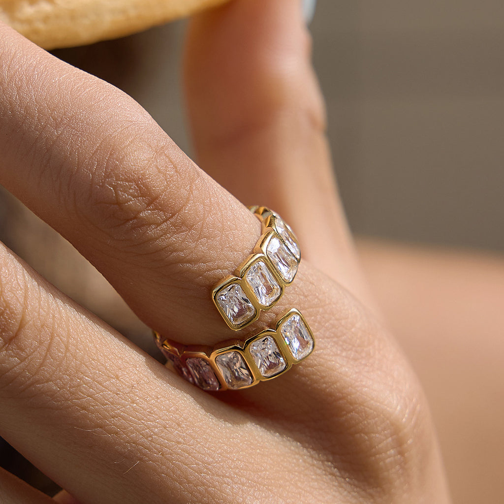 Offset rows of clear stones on a finger