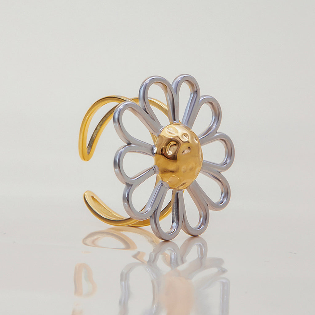 Side view of silver loop petals and textured gold center