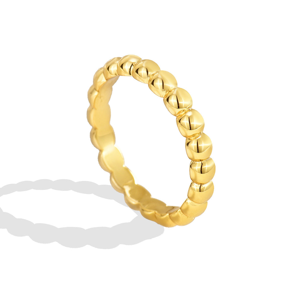 three-quarter studio view of the gold plated beaded band ring