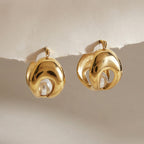 Double-layer hoop earrings with white pearl-look centers