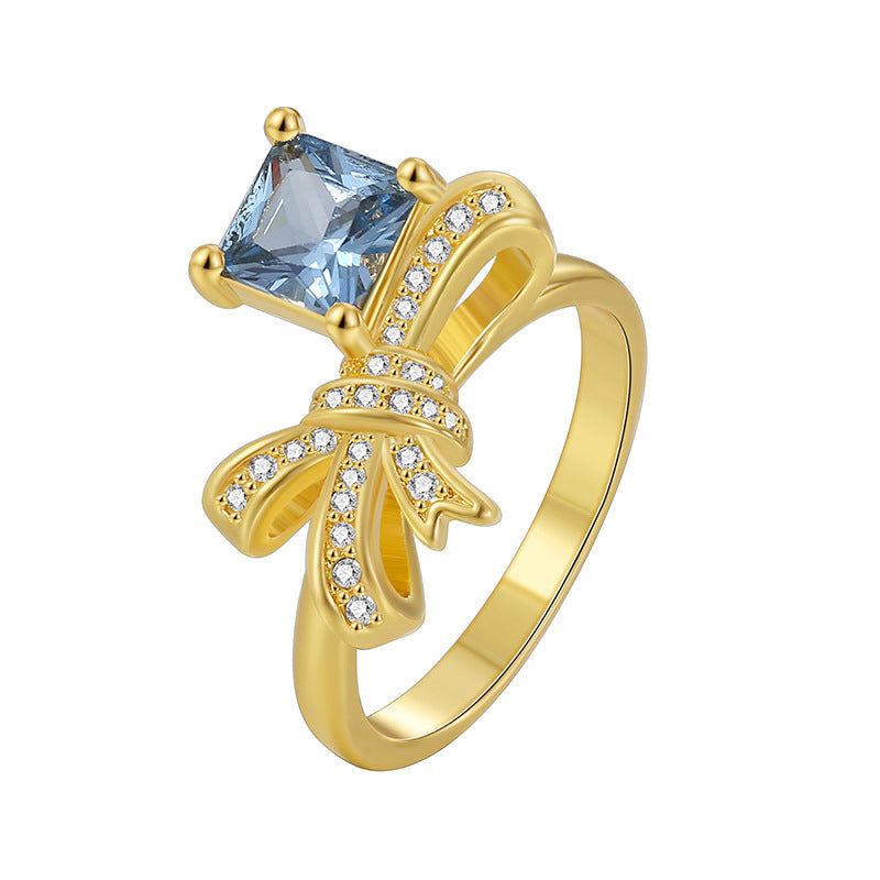 alternate isolated view of blue and clear stone bow ring