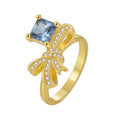 alternate isolated view of blue and clear stone bow ring