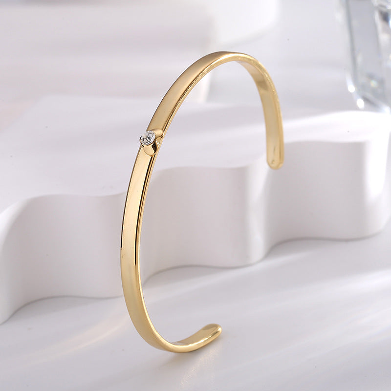upright profile of the polished gold plated brass cuff