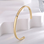 upright profile of the polished gold plated brass cuff