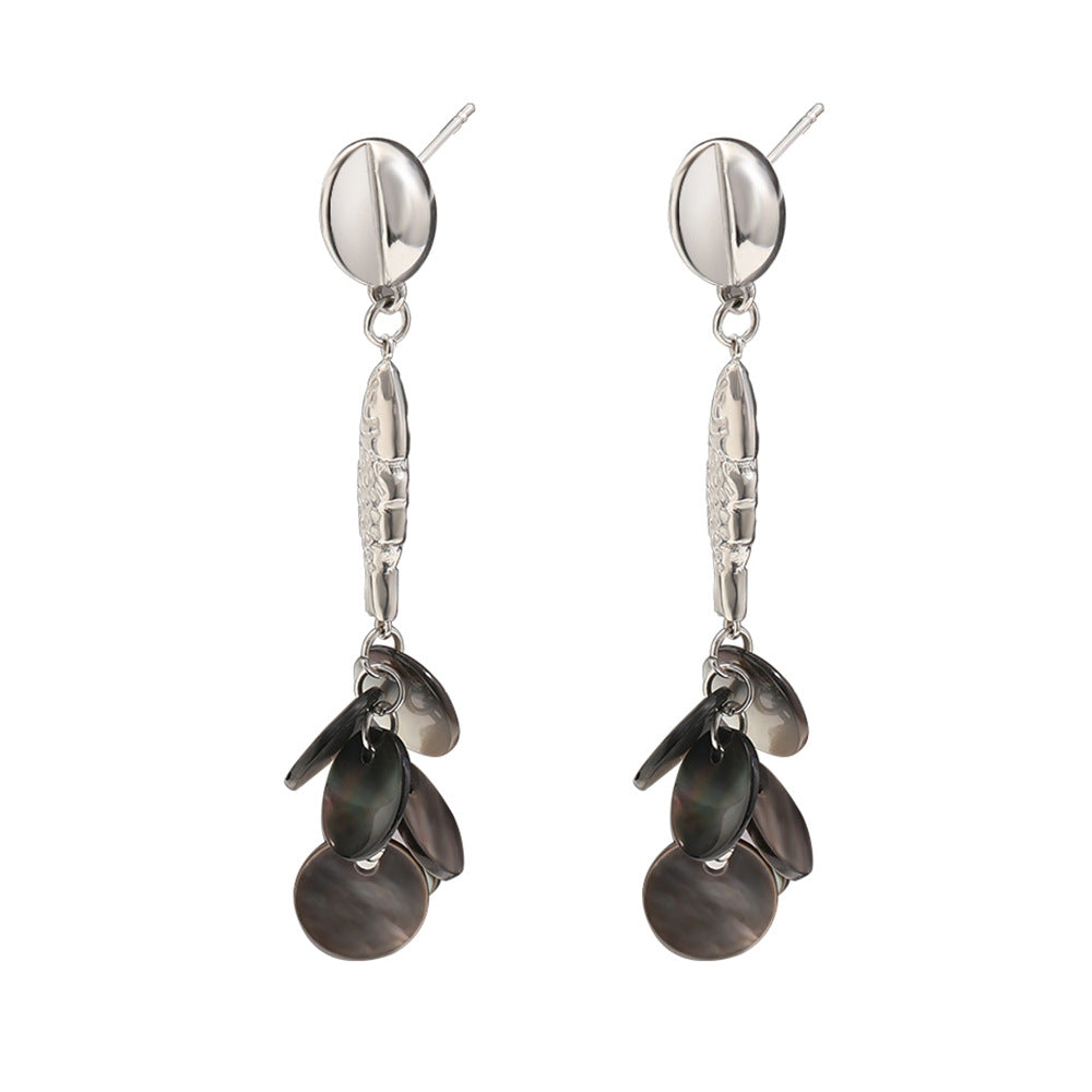 Steel color fish and shell disc earrings on white