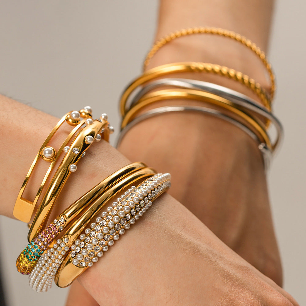 Gold plated stainless steel open cuff bracelet assortment worn view