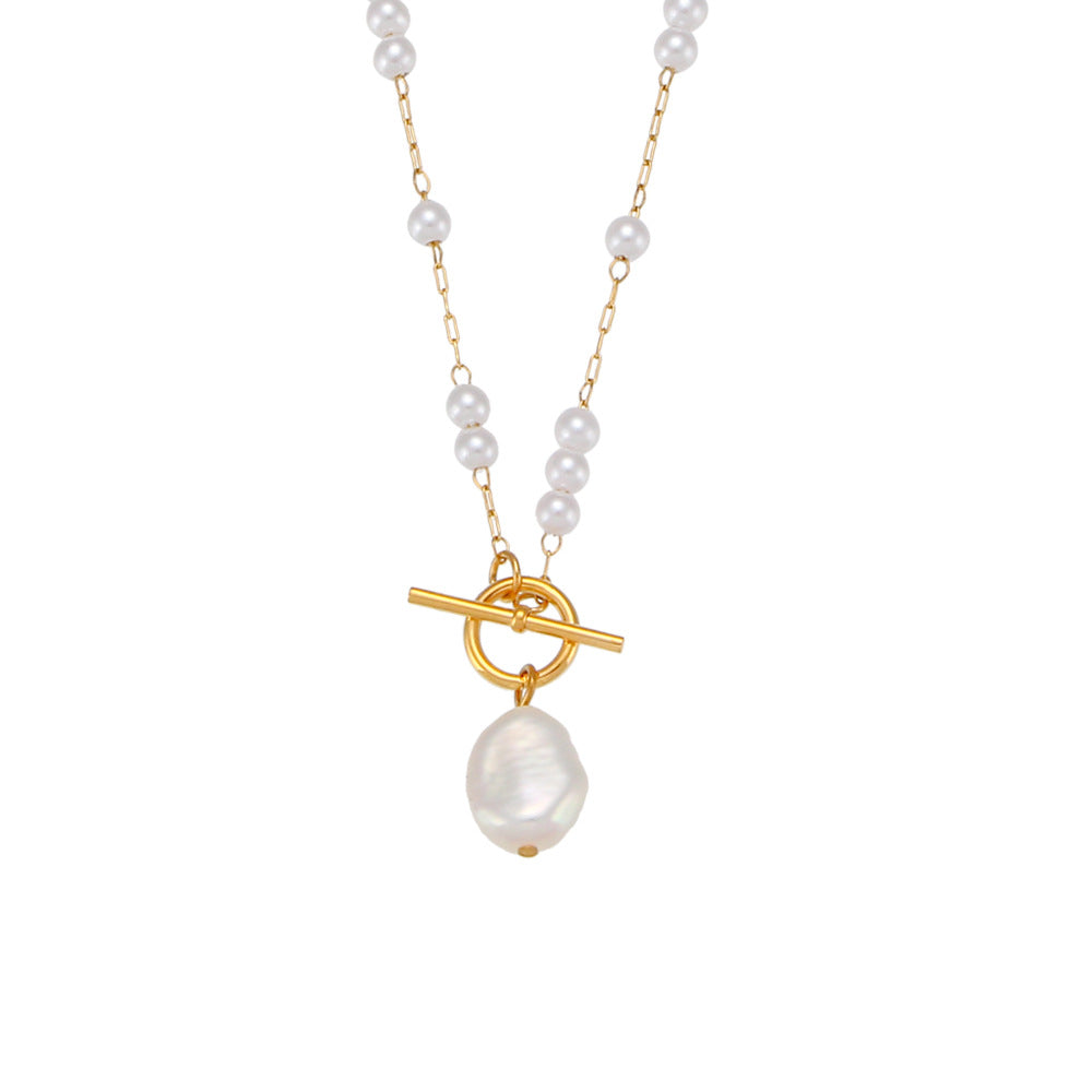 isolated gold plated asymmetrical toggle necklace with white beads