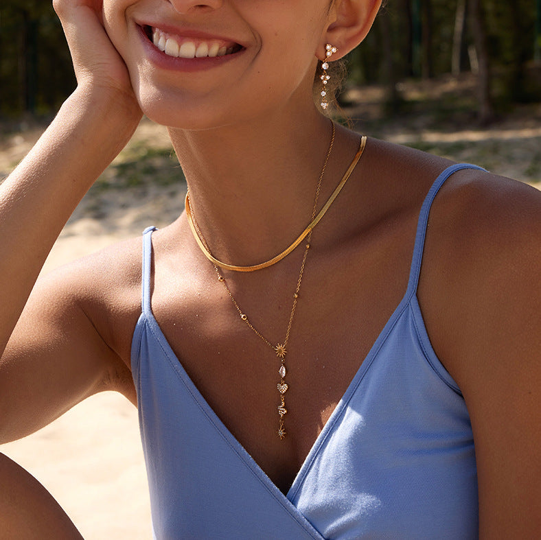Celestial Y necklace layered with a flat chain