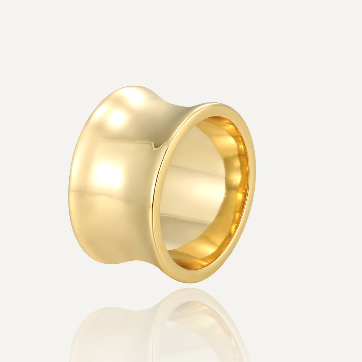 gold plated brass statement ring with a smooth concave wide band