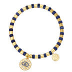 isolated lapis lazuli bracelet with blue and clear stone eye charm