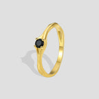gold plated brass solitaire ring with a round black stone