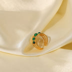 Green stone stainless steel ring in a styled display