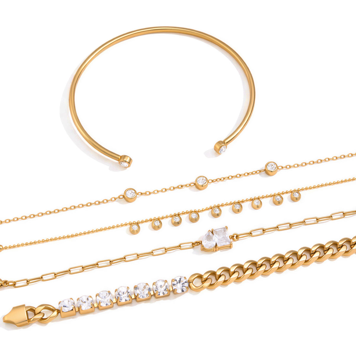 Bracelet chains and open cuff shown on white