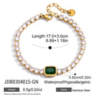 Green-center gold-tone tennis bracelet