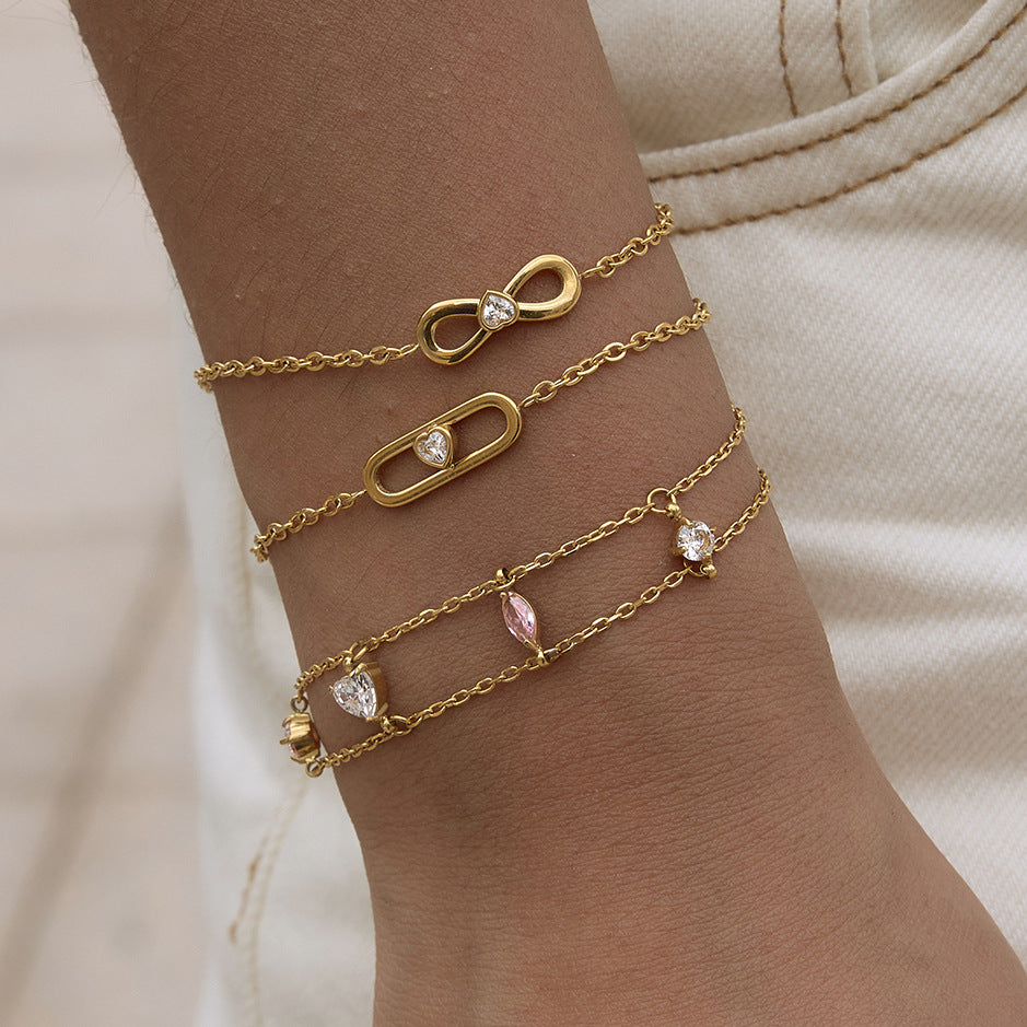 Infinity oval and double-chain bracelets worn together