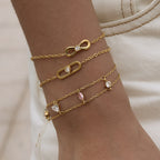 Infinity oval and double-chain bracelets worn together