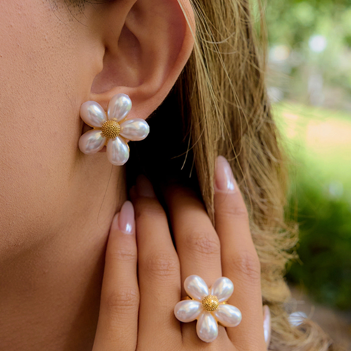 Flower stud earrings and the separate flower ring worn together