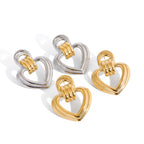 Two-Tone Open Heart Stainless Steel Drop Earrings — worn scale of the heart drops