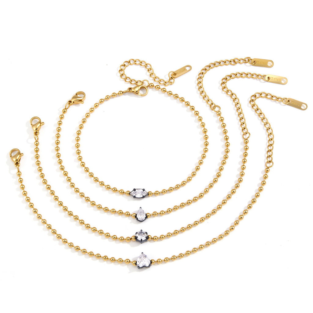 Four solitaire bead-chain bracelets on white