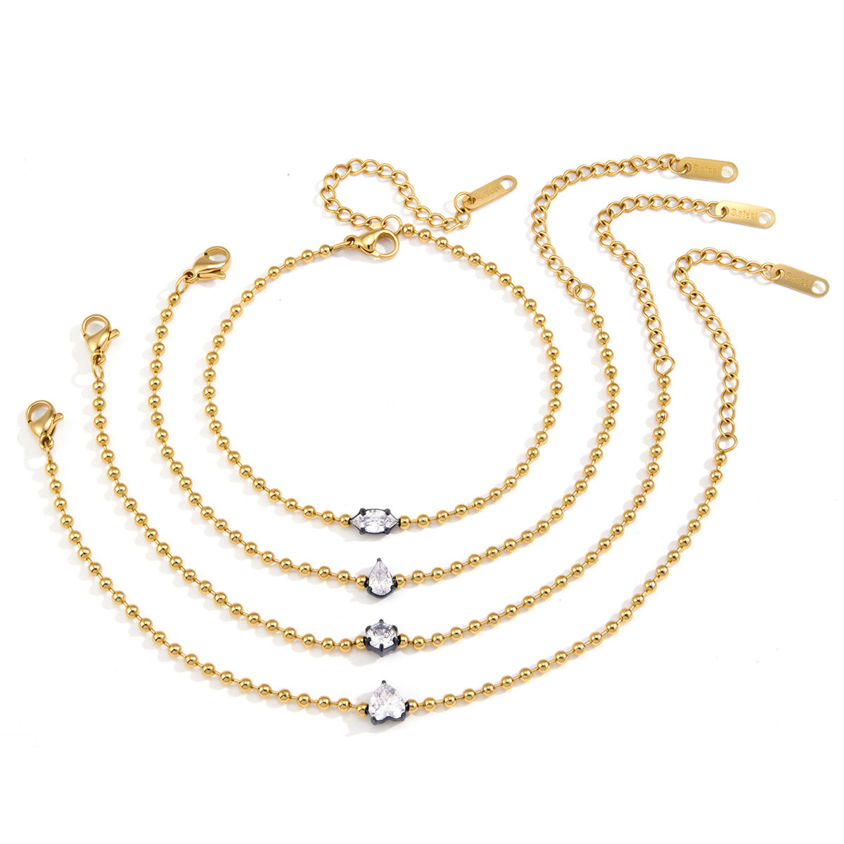 Four solitaire bead-chain bracelets on white