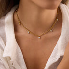 Single mixed-shape charm necklace at neckline