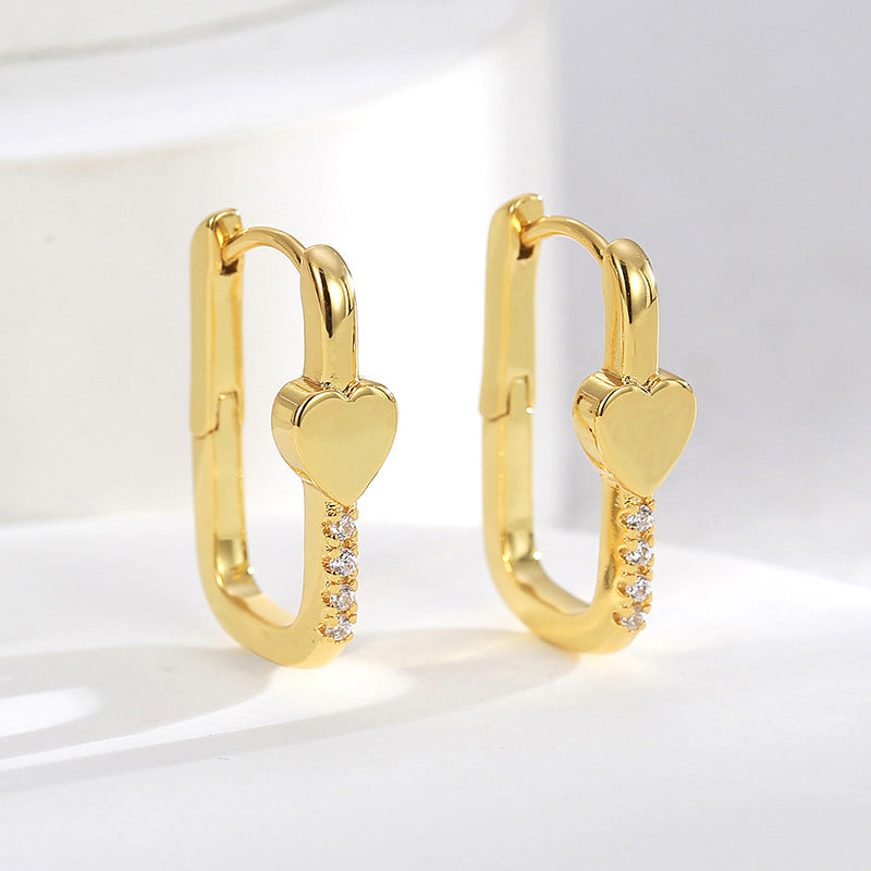 pair of gold plated rectangular heart zirconia huggie earrings