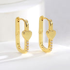 pair of gold plated rectangular heart zirconia huggie earrings