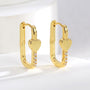 pair of gold plated rectangular heart zirconia huggie earrings