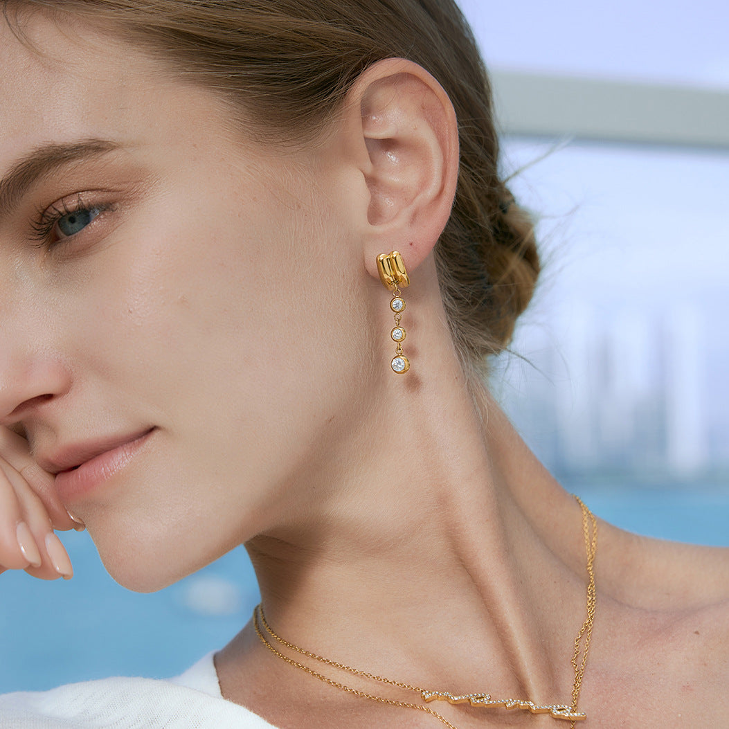 Graduated round drop earring shown in profile
