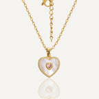 gold plated stainless steel heart necklace with iridescent white inlay and pink stone