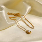 Necklace arranged on satin showing the raised pearl-look center
