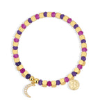 isolated purple and magenta bracelet with clear stone crescent charm