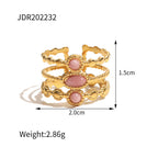 Three-row openwork ring with pink oval and round accents