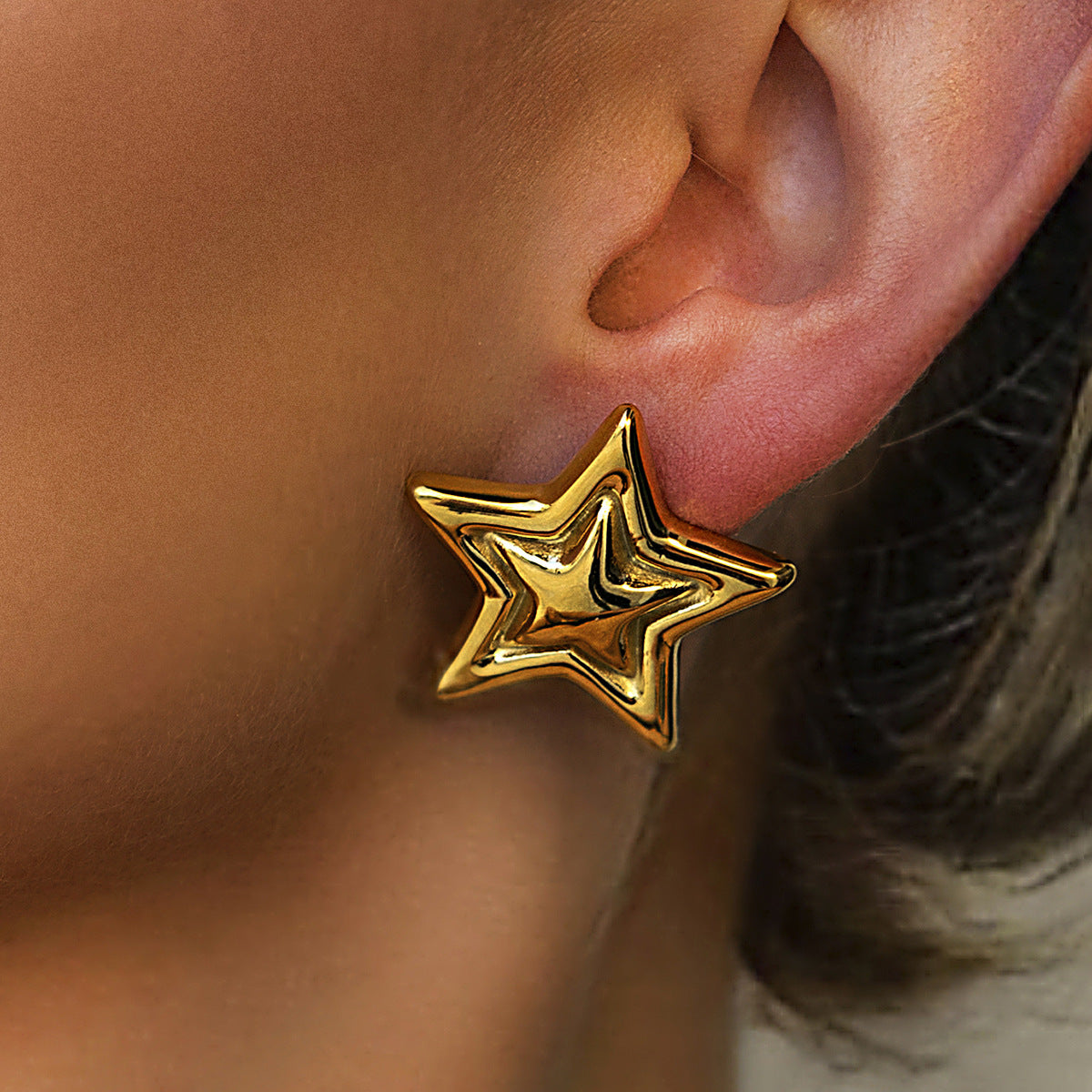 Two-Tone Sculptural Star Stainless Steel Stud Earrings on-model view