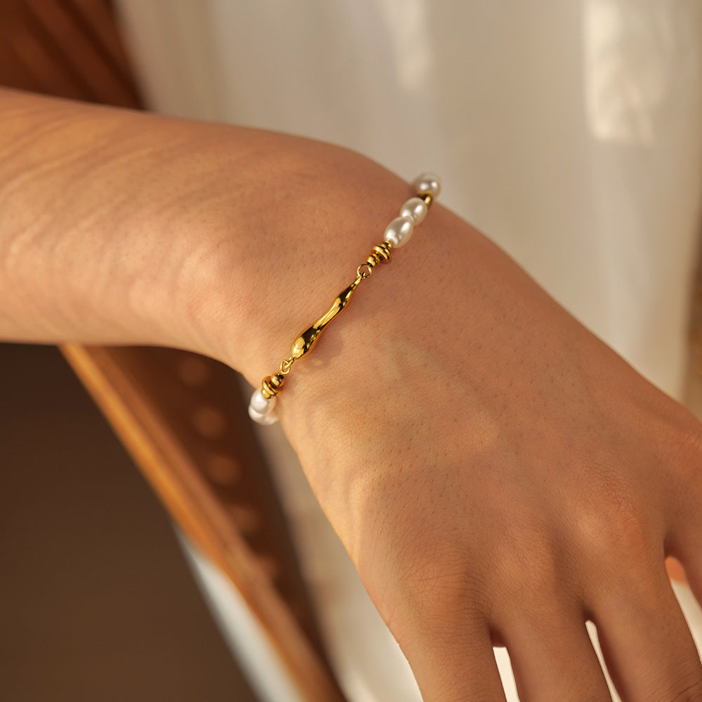 sculptural white bead bracelet shown from a second wrist angle