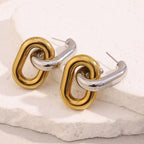 angled view of two-tone interlocking link drop earrings