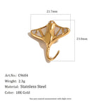 Pale-inlay ray charm and curled tail