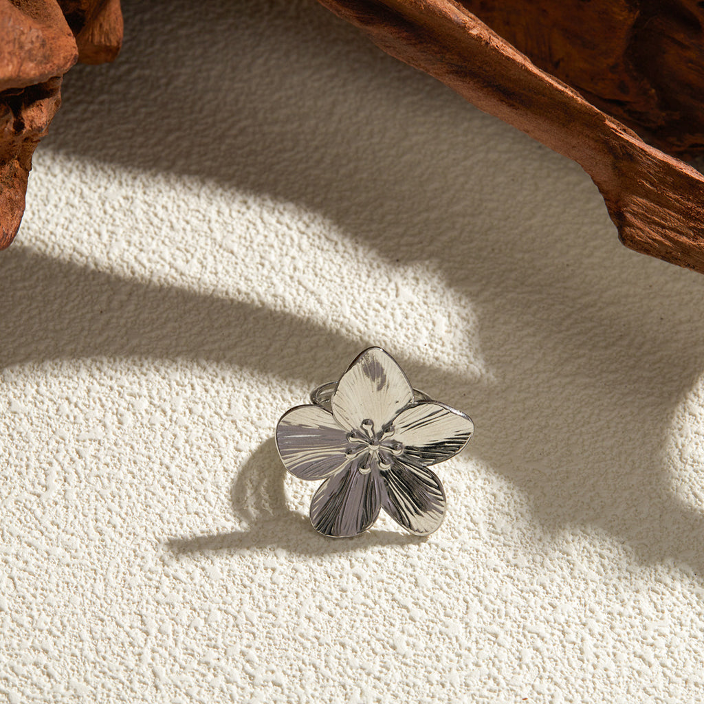 Polished Stainless Steel Textured Flower Statement Ring — angled view