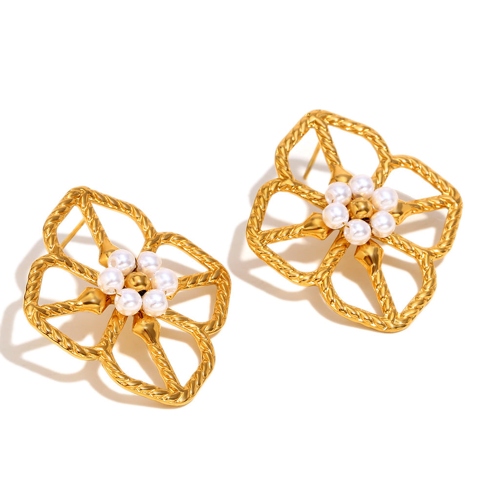 angled view of openwork flower studs with central bead clusters