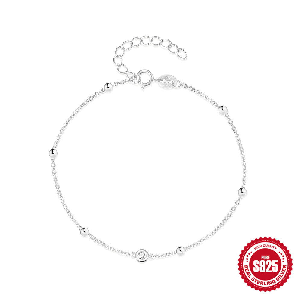 925 Sterling Silver Beaded Zirconia Station Bracelet — silver bracelet laid flat