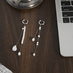 asymmetric stainless steel pearl-style tassel earring pair