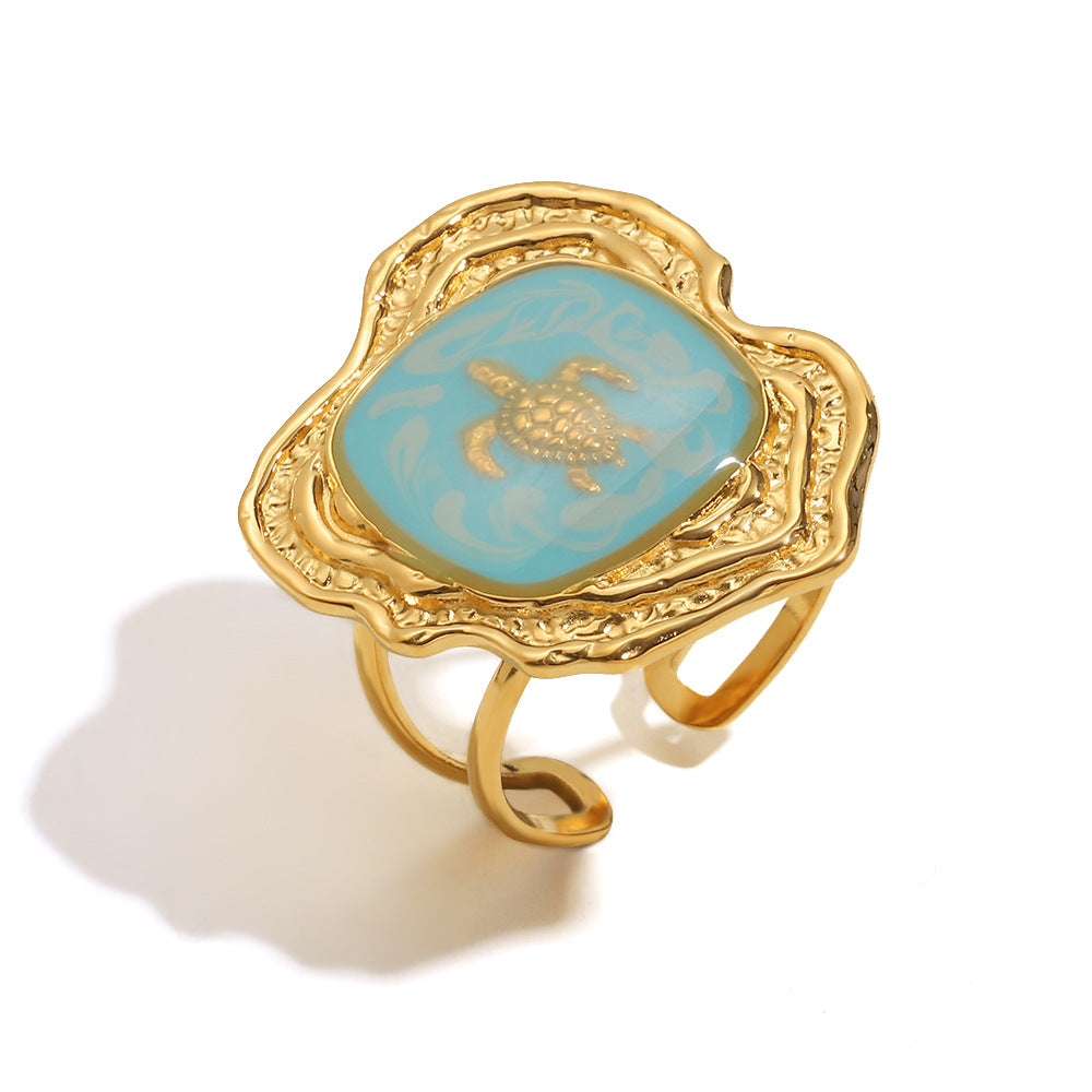 isolated gold plated stainless steel turtle open ring