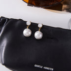 Imitation Pearl and Clear Stone Stainless Steel Drop Earrings — paired earrings on a neutral surface