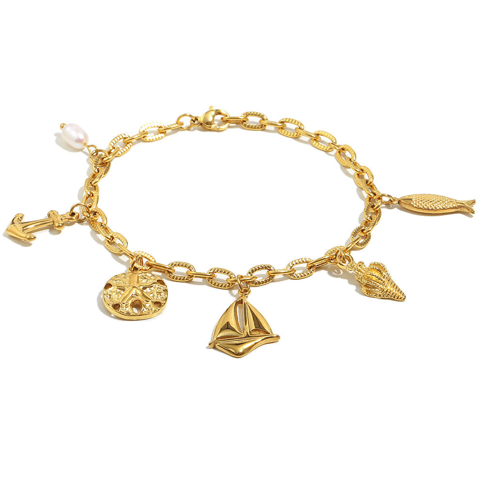 Gold Plated 316L Stainless Steel Coastal Charm Bracelet — anchor sailboat shell and fish charms