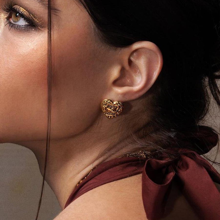 Gold-tone heart earrings close-up