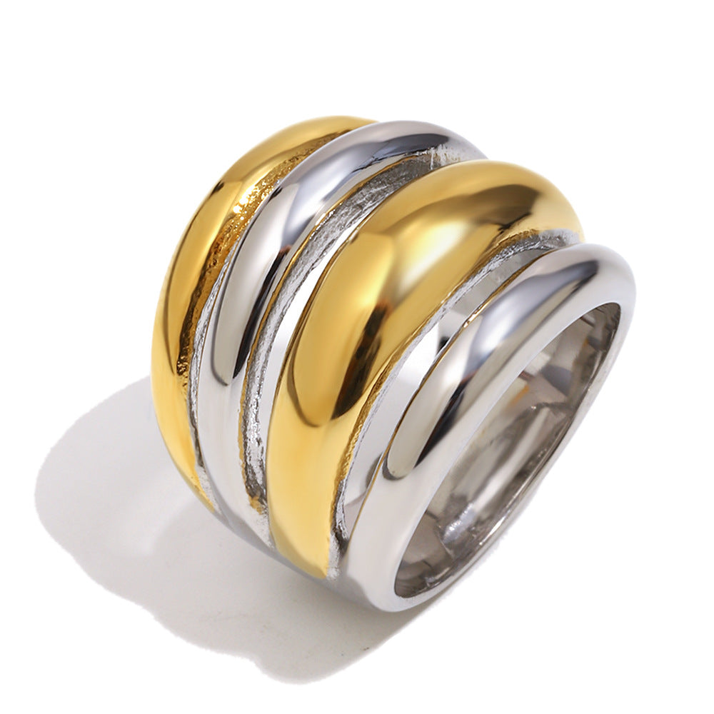 isolated polished gold and silver layered band ring