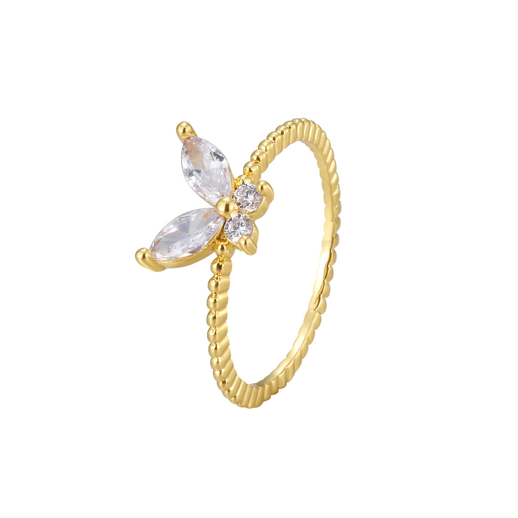 isolated gold plated butterfly clear stone ring on white
