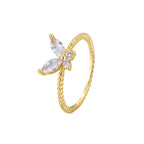 isolated gold plated butterfly clear stone ring on white