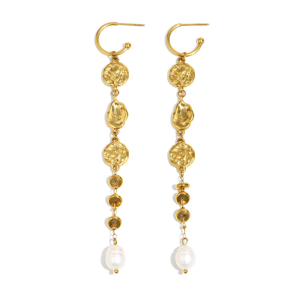 long medallion link earrings with white pearl tips on white